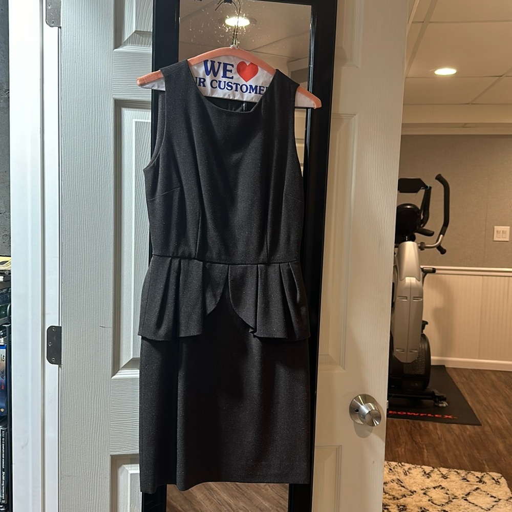 Beautiful Walter Baker sleeveless dress with peplum style